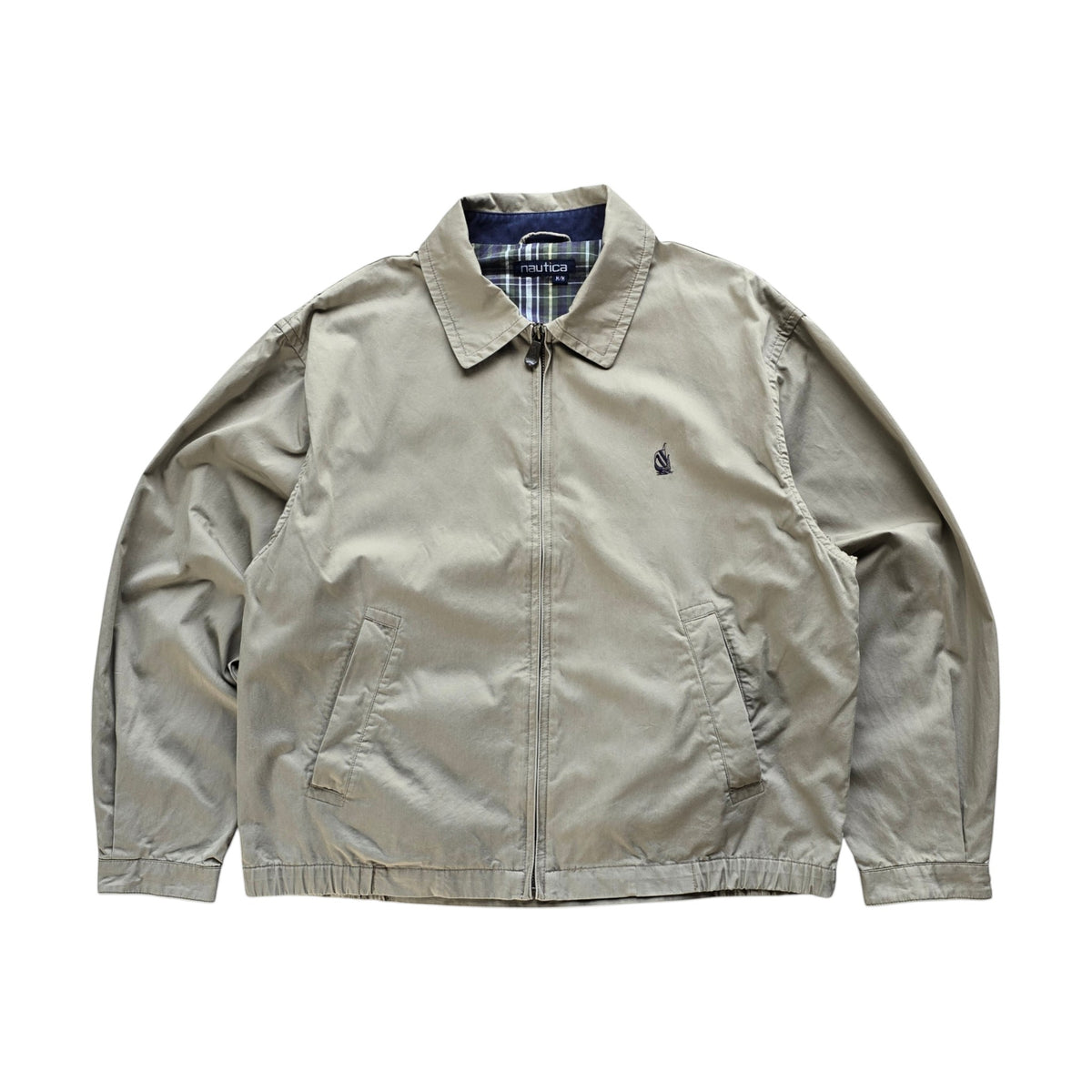 DEEP VINTAGE 90s Nautica Harrington jacket in beige with a classic collar, zip front, and plaid interior lining.