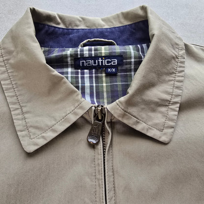 DEEP VINTAGE beige Nautica Harrington jacket with a plaid lining and branded zipper pull, size medium.