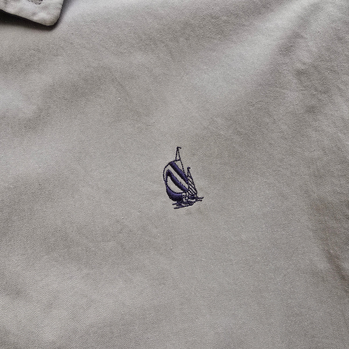 DEEP VINTAGE beige 90s Nautica Harrington jacket featuring a small embroidered navy blue sailboat logo on the chest