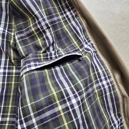 DEEP VINTAGE 90s Nautica Harrington jacket interior featuring a green, blue, and yellow plaid lining and zipper pocket