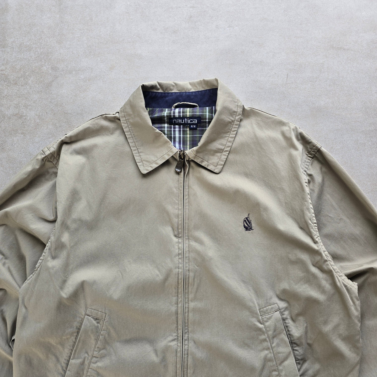 DEEP VINTAGE beige 90s Nautica Harrington jacket with a classic collar and plaid lining