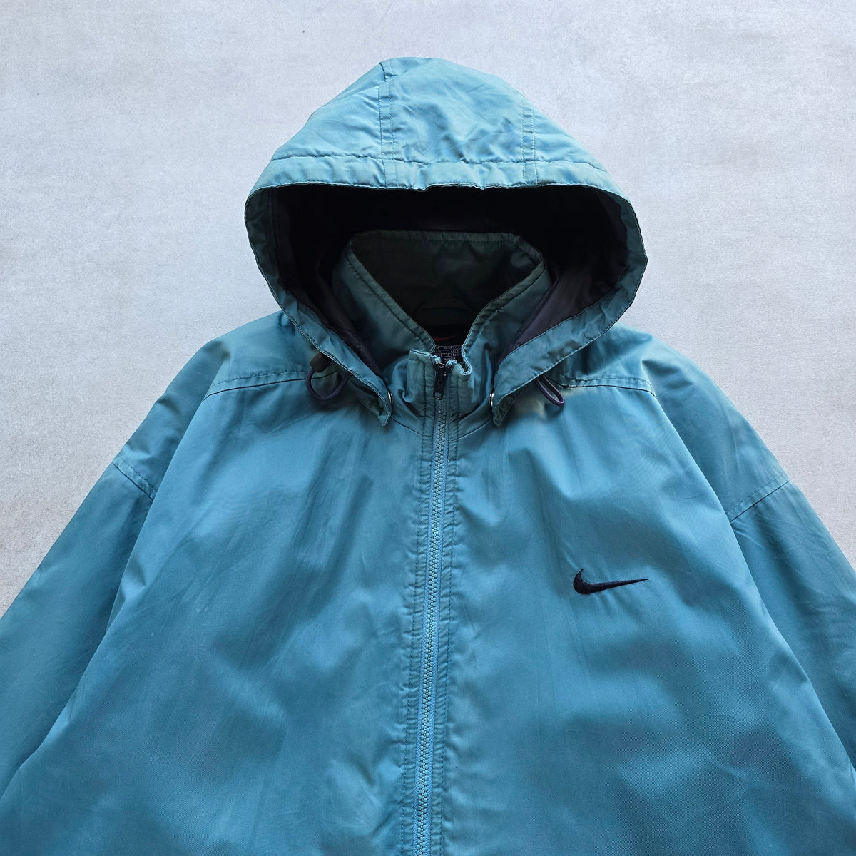 DEEP VINTAGE teal 90s Nike zip-up jacket with a detachable hood and embroidered swoosh logo