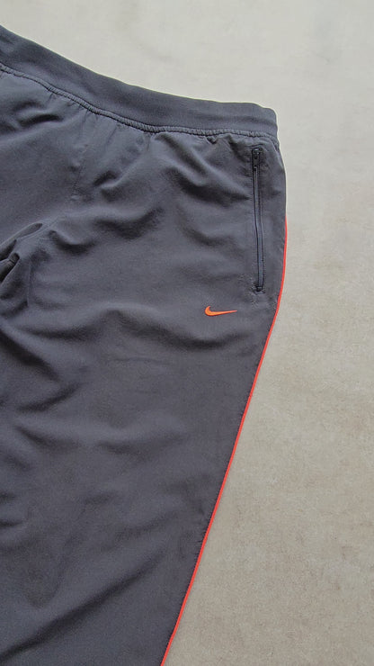 Vintage Nike Mini Swoosh Ankle Zip Track Pants - L
